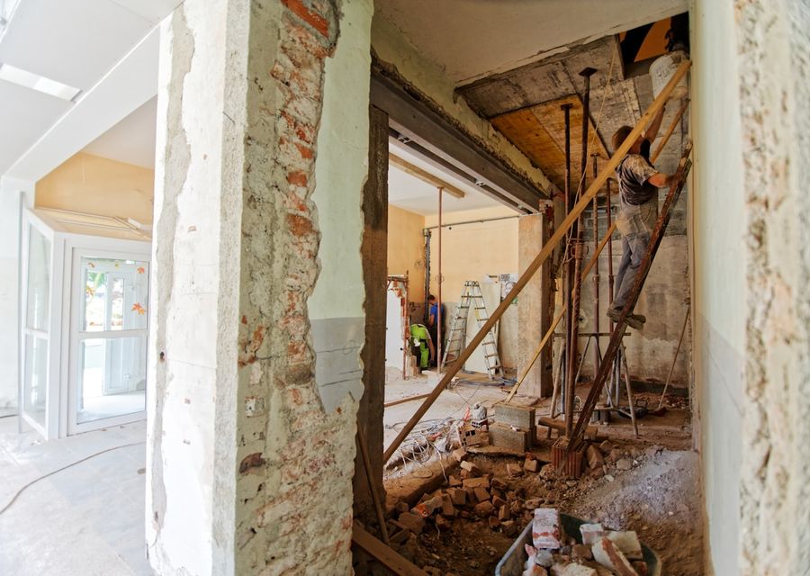 A property mid-renovation with structural propping in place